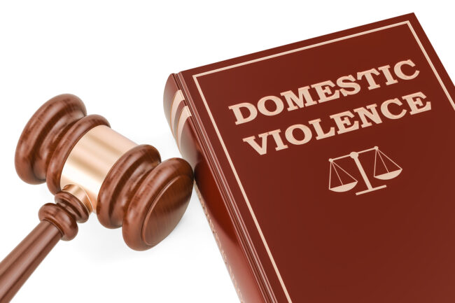 Domestic violence concept with gavel and book 3D rendering