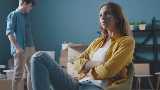 angry-couple-fighting-while-moving-in-their-new-ho-2021-08-28-15-25-45-utc