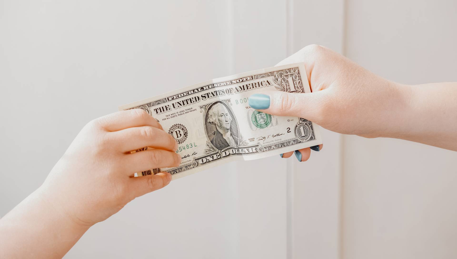 pocket-money-concept-woman-s-hand-giving-dollar-n-2022-01-07-17-16-39-utc